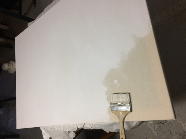 stretched canvas, mostly primed