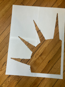 a stencil of the crown of the Statue of Liberty